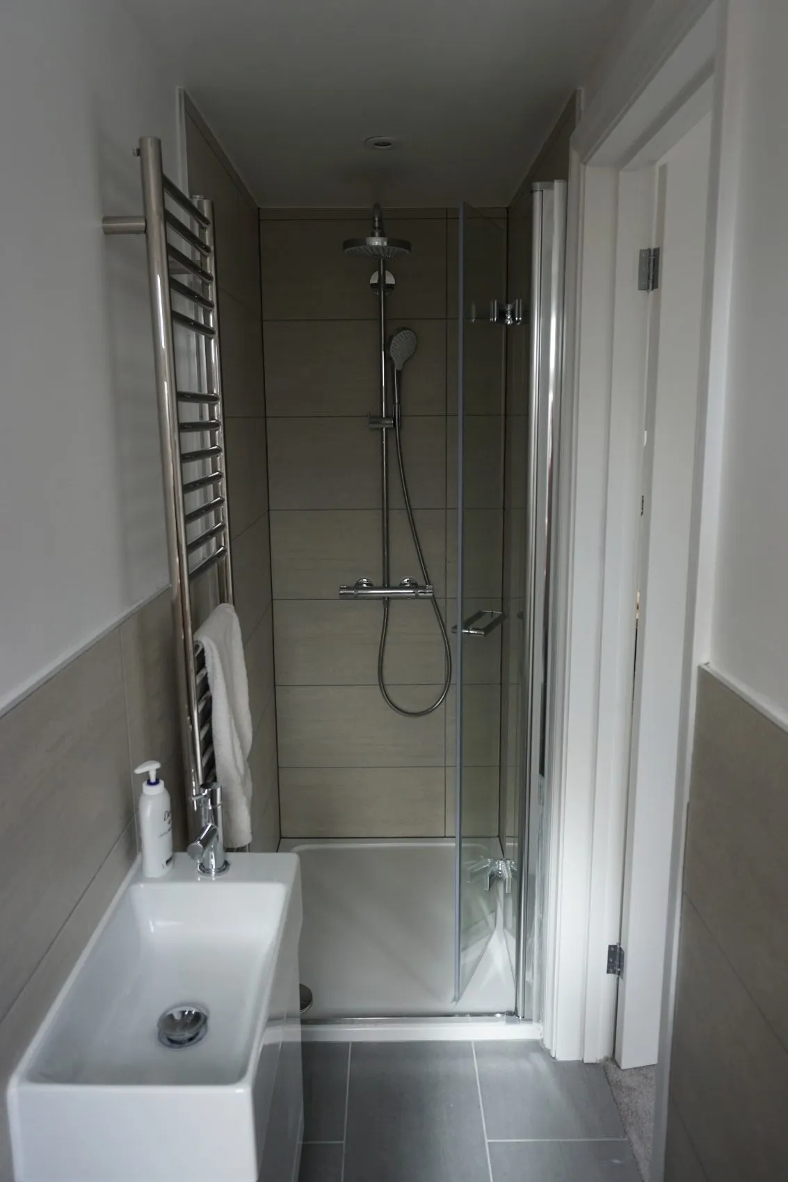 Light-filled loft bathroom with walk-in shower